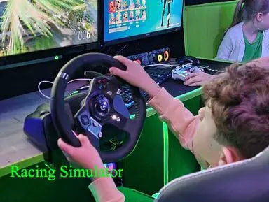 racing simulator on gaming bus kids having fun,racingsimulator,cars,race,gaming,gamingbus,pc,greenbus,redbus,gaminguk,gamingessex