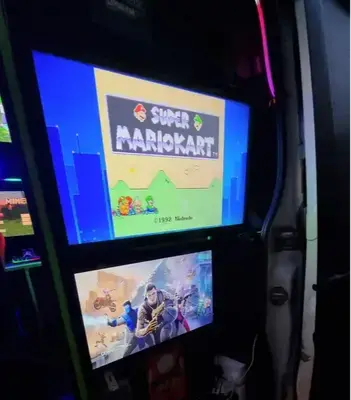 Retro Super Mario Kart playing on screens inside the Streetside Gaming Bus in Brightlingsea