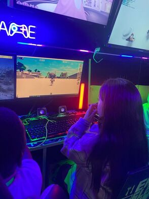 Child playing on the gaming PC inside the Streetside Gaming Bus