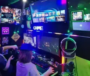 Children playing on the gaming PC inside the Streetside Gaming Bus in Basildon