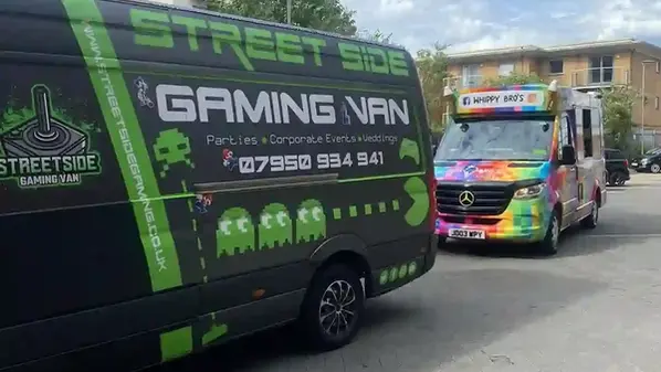 Streetside Gaming Van parked beside a colourful Whippy Bros ice cream van
