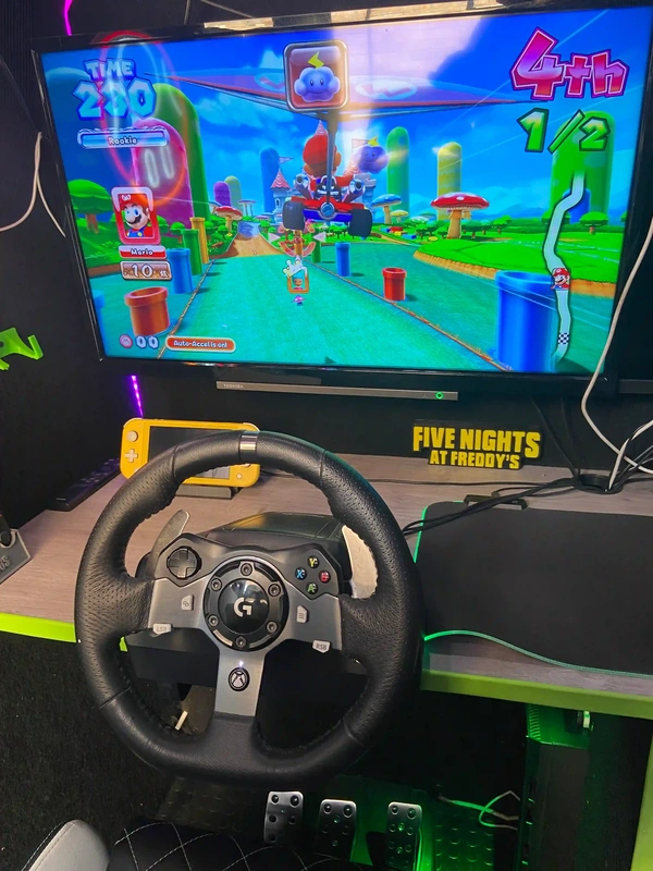 Mario Kart racing simulator inside the Streetside Gaming Bus in Great Dunmow