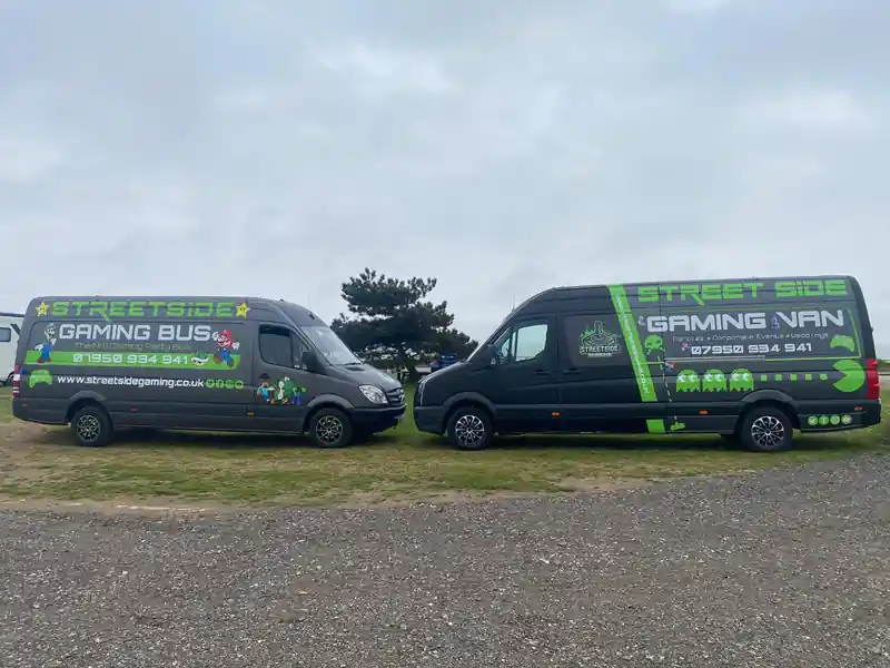 Two Streetside gaming buses parked together, offering mobile gaming parties across Essex and Suffolk.