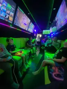 Children gaming together inside the Streetside Gaming Bus in Sudbury