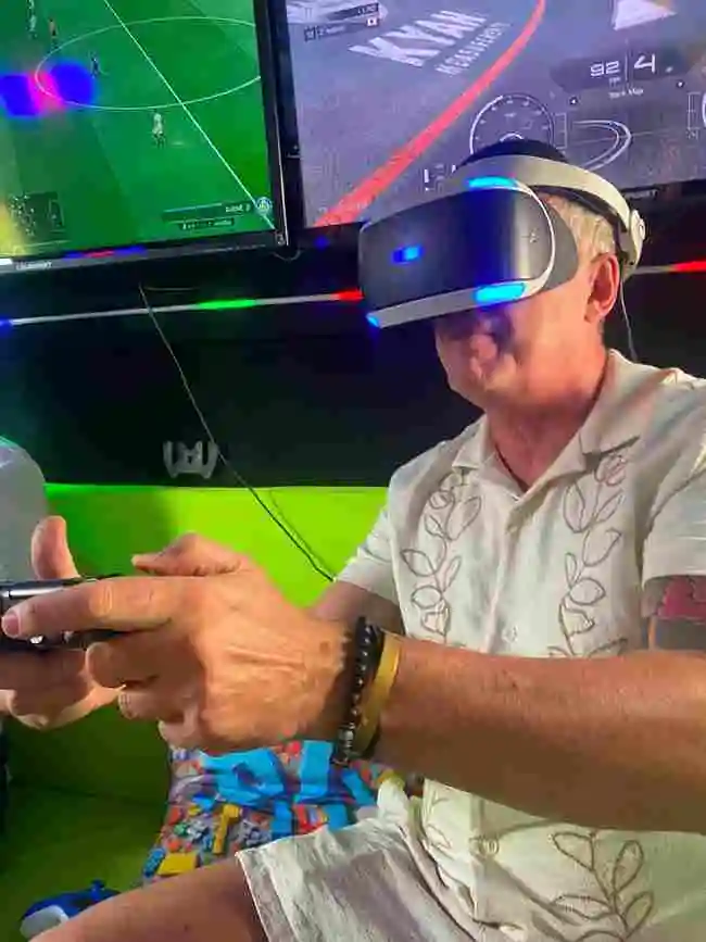 Adult enjoying a VR gaming experience inside the Streetside Gaming Bus