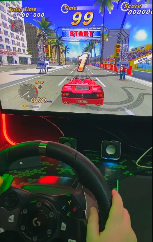 OutRun racing game on Streetside Gaming Bus steering wheel and pedals